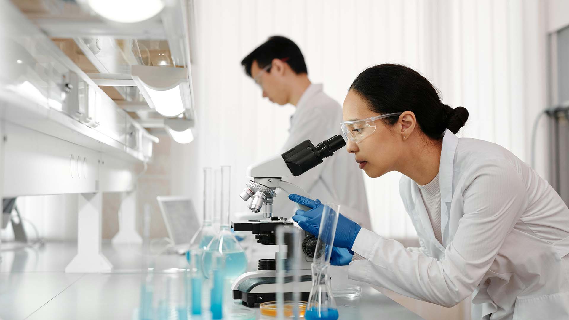 Scientists using lab equipment