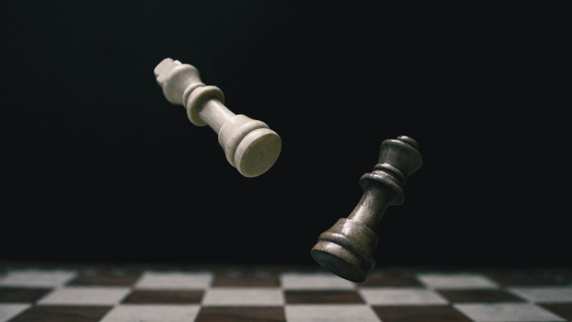 a white pawn and a black pawn chess pieces