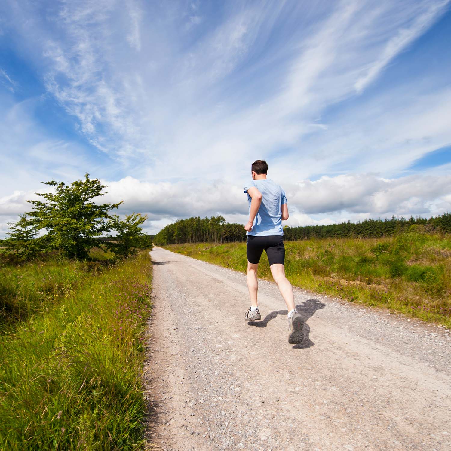 man running down a trail