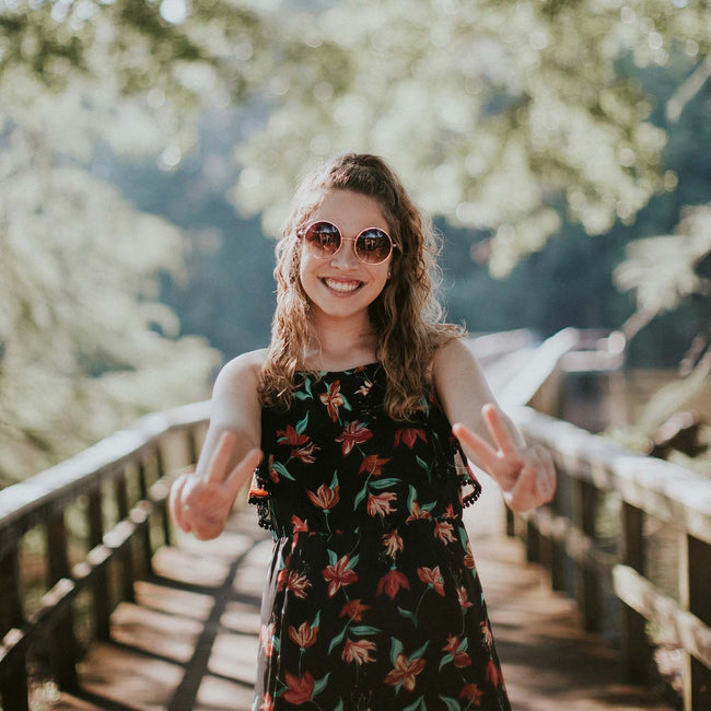 Smiling woman giving the peace sign